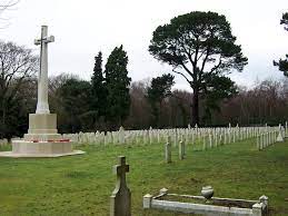 Netley Military Cemetery with rows of gravestones and the Cross of Sacrifice