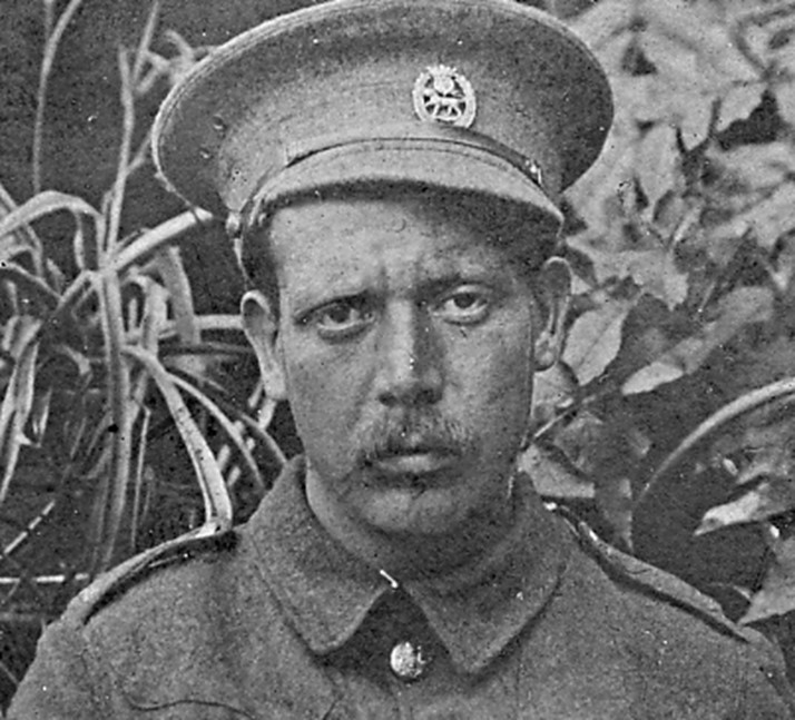 head and shoulders photograph of aaron smeaton wearing his army uniform and his army cap