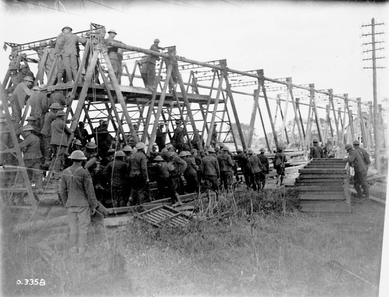Soldiers building a bridge over the Canal du Nord