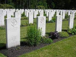 Bergen-Op-Zoom War Cemetery with close up of some of the gravestones with plants between them