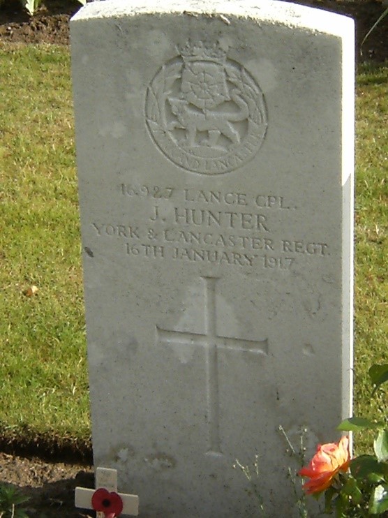 Joseph's gravestone inscribed with his regimental badge, name and date of deathe, his name