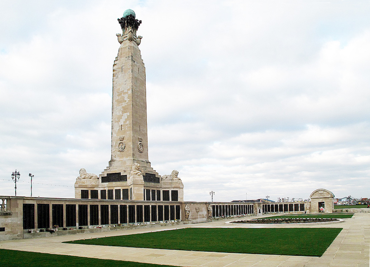 Photo of Portsmouth Naval Memorial. A large stone tower with square grass lawns in front