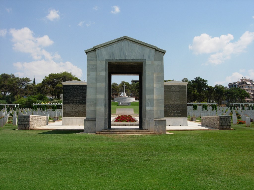 The Athens Memorial with rows of graves behind