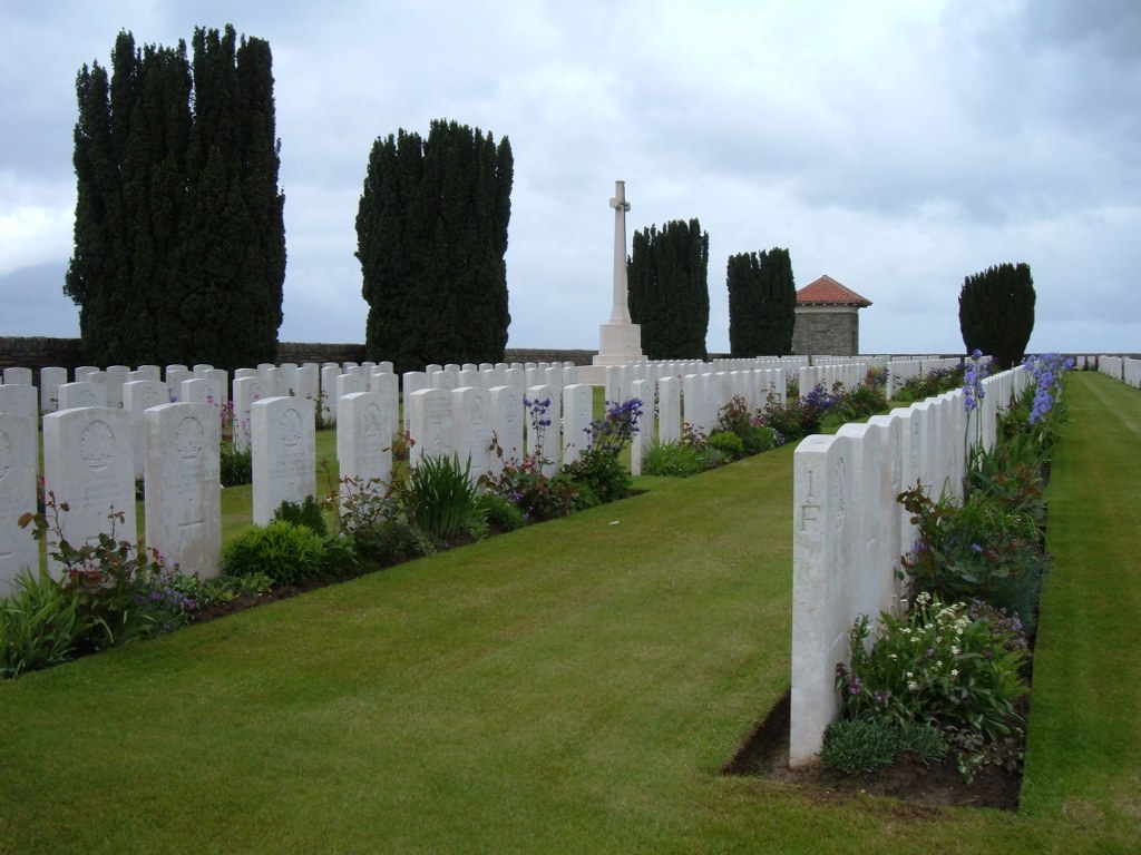 Vaulx Hill Cemetery with rows of graves and flowers between them