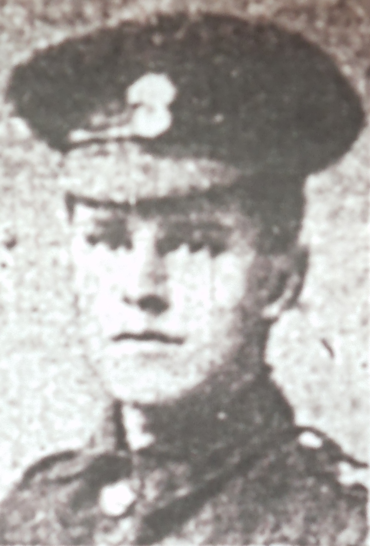 black and white image of henry hackett doggett's face and shoulders. he is wearing his army uniform including a cap