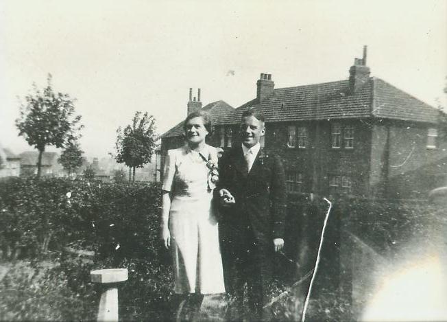 irene and harry briscoe in a back garden, taken on their wedding day