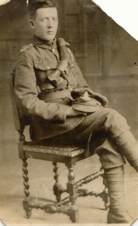 George William Hardy sitting in a chair wearing his army uniform