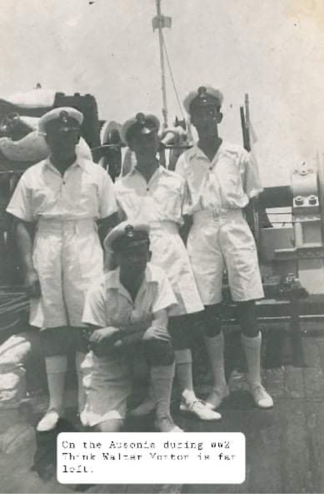 three naval men pose for photograph in their white uniforms, walter might be the man on the left. all the men are standing on the deck of hms ausonia