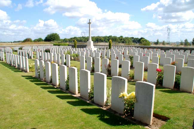 Assevillers New British Cemetery with rows of gravestones